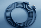 AVOLT USB-C charging cable coiled on blue background, both AVOLT-branded USB‑C connectors visible.